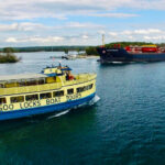 Famous Tour Boat passing a freighter